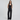Black tailored matching set with a double-breasted square-neck vest and high-waisted straight-leg pants, styled for work to evening.