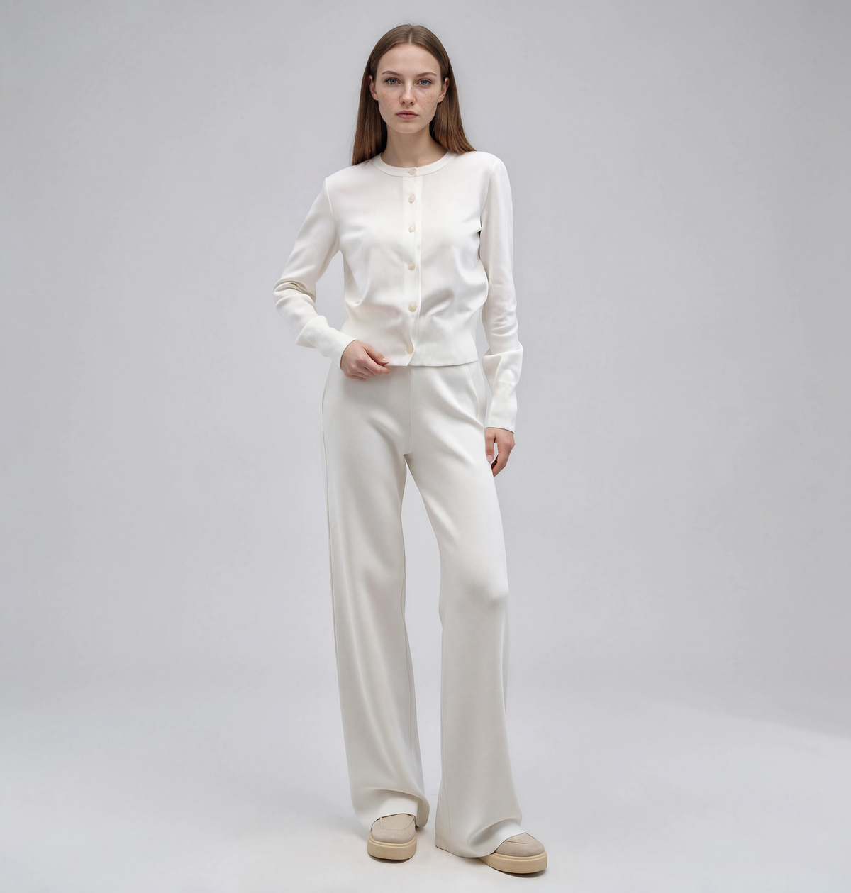 White knit set with a button-front crew-neck cardigan and wide-leg pants, women's soft knit two-piece.