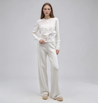 White knit set with a button-front crew-neck cardigan and wide-leg pants, women's soft knit two-piece.