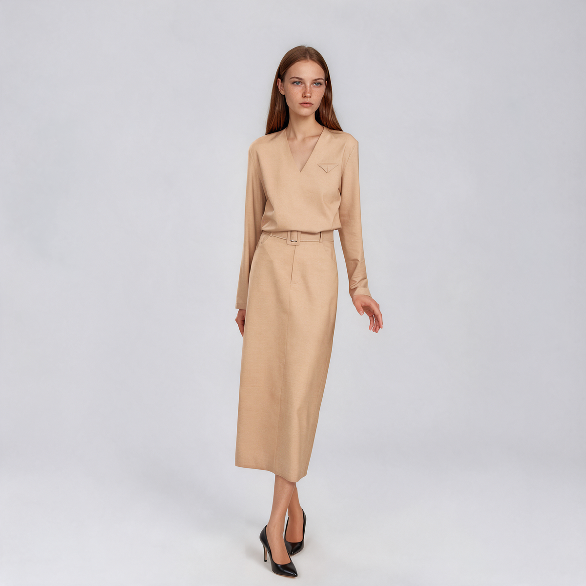 Oatmeal beige workwear set with a V-neck long-sleeve top and high-waisted belted midi pencil skirt, styled for professional women.