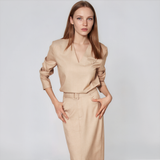 Oatmeal beige workwear set with a V-neck long-sleeve top and high-waisted belted midi pencil skirt, styled for professional women.