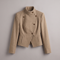A beige double-breasted wrap jacket with a high mock neck and brown buttons, displayed flat against a neutral gray background.