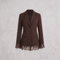 A dark brown blazer-style jacket with notched lapels, two front buttons, flap pockets, and a lace hem detail, shown against a light gray textured background.