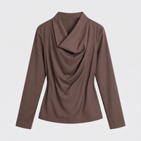 A women's long-sleeve top in a solid medium brown color, featuring a draped cowl neckline, shown against a light gray background.